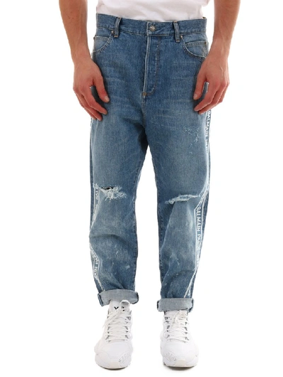 Shop Balmain Logo Distressed Jeans In Blue