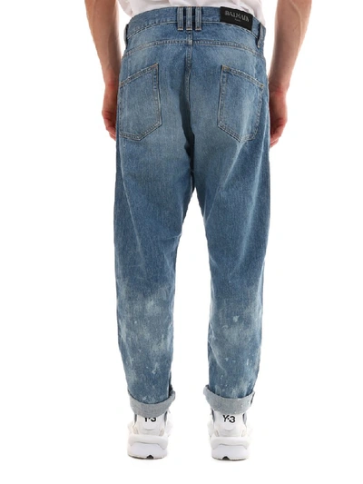 Shop Balmain Logo Distressed Jeans In Blue