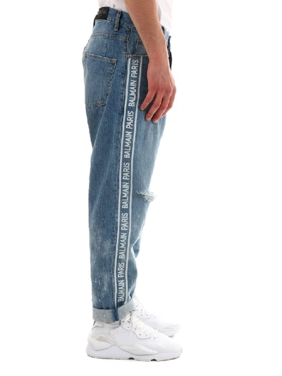 Shop Balmain Logo Distressed Jeans In Blue