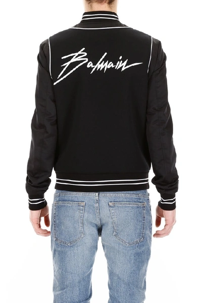 Shop Balmain Contrast Logo Bomber Jacket In Black
