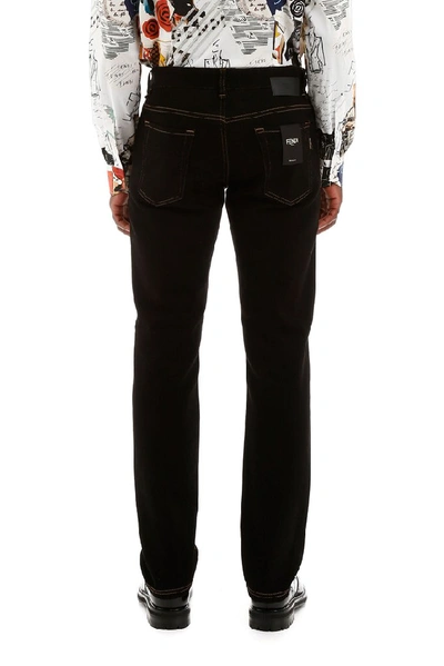 Shop Fendi Karligraphy Embroidered Jeans In Black