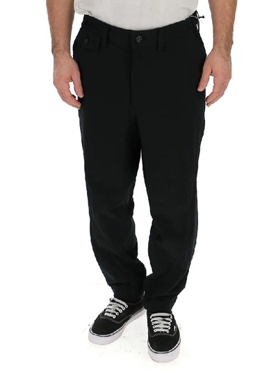Shop Issey Miyake Tapered Trousers In Black