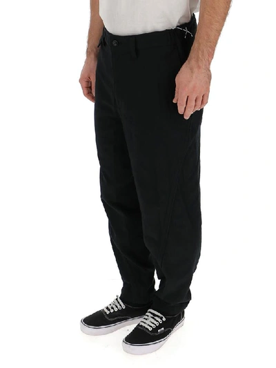 Shop Issey Miyake Tapered Trousers In Black