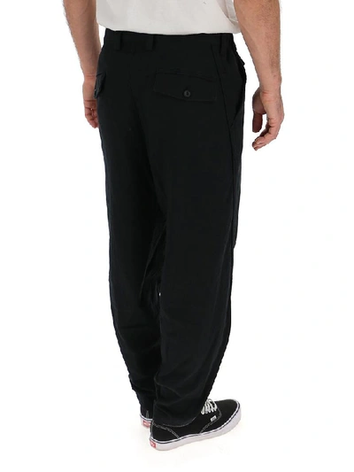 Shop Issey Miyake Tapered Trousers In Black