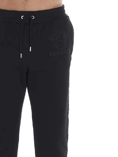 Shop Versace Logo Printed Track Pants In Black