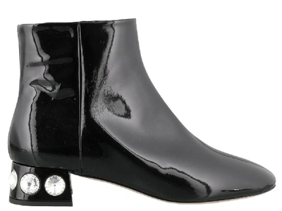 Shop Miu Miu Crystal Embellished Ankle Boots In Black