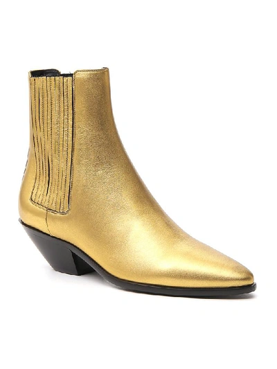 Shop Saint Laurent Wyatt Ankle Boots In Gold