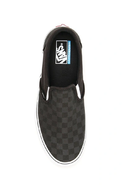 Shop Vans Checkerboard Slip On Sneakers In Black