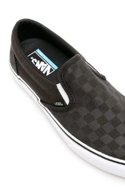 Shop Vans Checkerboard Slip On Sneakers In Black