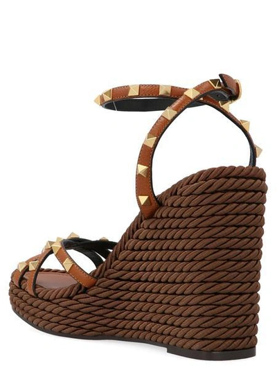 Shop Valentino Garavani Rockstud Wedge Sandals In Brown