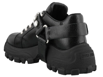 Shop Miu Miu Buckled Low Top Sneakers In Black