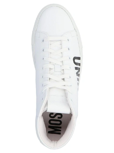 Shop Moschino Logo Lace Up High Top Sneakers In White