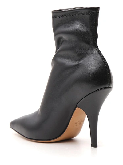 Shop Valentino Vltn Heeled Boots In Black