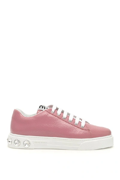 Shop Miu Miu Crystal Embellished Sneakers In Pink