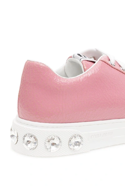 Shop Miu Miu Crystal Embellished Sneakers In Pink