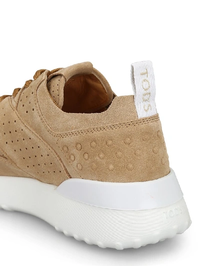 Shop Tod's Perforated Sneakers In Beige