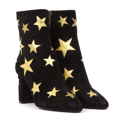 Shop Saint Laurent Star Embossed Ankle Boots In Black