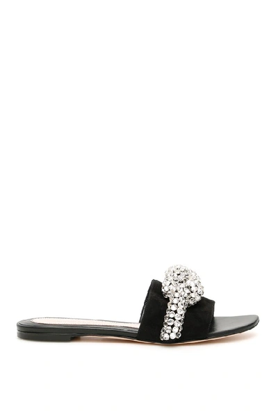 Shop Alexander Mcqueen Crystal Embellished Knot Mules In Black