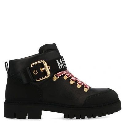 Shop Moschino Logo Buckle Combat Boots In Black