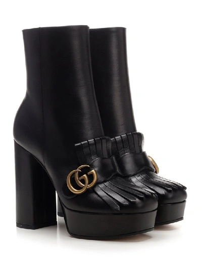 Shop Gucci Gg Marmont Heeled Ankle Boot In Black