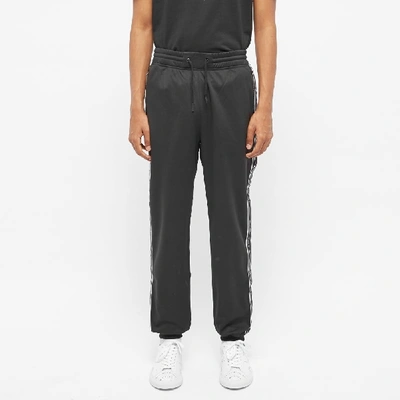 Shop Givenchy Taped Logo Track Pant In Black