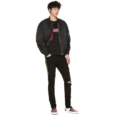 Shop Amiri Black Leopard Half Track Broken Jeans In Bll