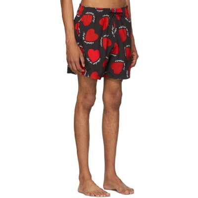 Shop Amiri Black And Red Hearts Swim Shorts In Blk