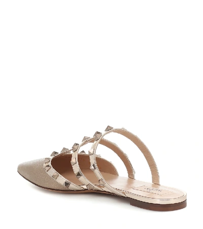 Shop Valentino Rockstud Leather Slippers In Gold