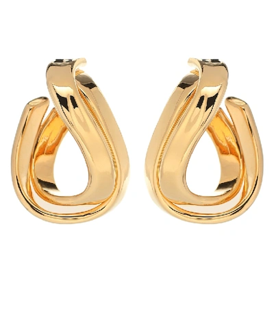 Shop Balenciaga Twisted Hoop Earrings In Gold