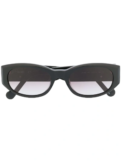 Shop Liu •jo Slim Oval Frame Sunglasses In Black