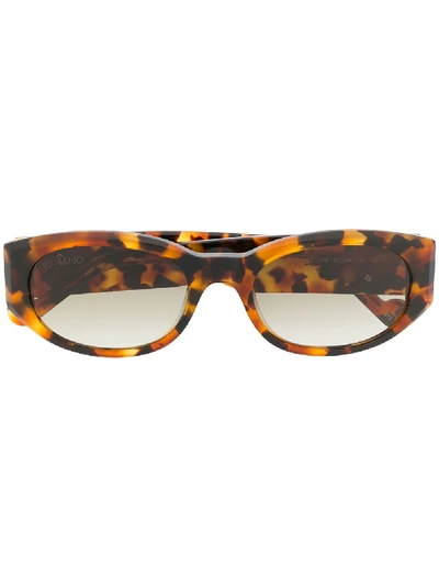 Shop Liu •jo Slim Oval Frame Sunglasses In Brown