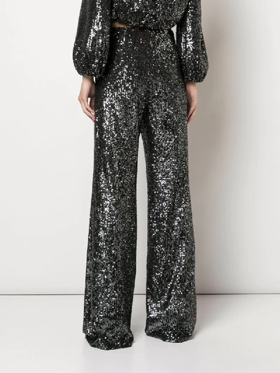 Shop Alice And Olivia Dylan Sequin Flared Trousers In Black