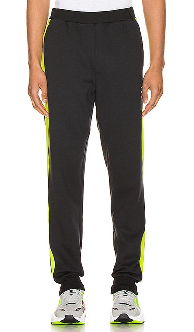 Shop Puma X Ader T7 Trousers In Black