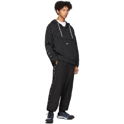 Shop Nike Black Swoosh Pullover Jacket In 010blackwhi