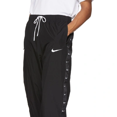 Shop Nike Black Swoosh Lounge Pants In 010blackwhi