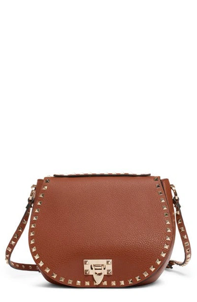 Shop Valentino Small Rockstud Leather Saddle Bag In Selleria