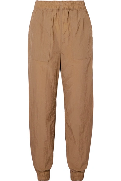 Shop Ganni Tech-shell Track Pants In Sand