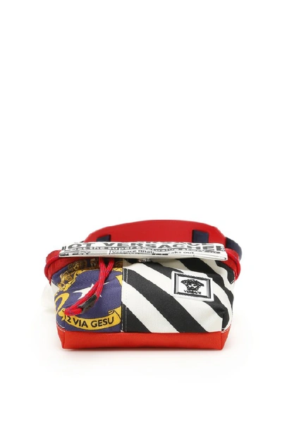 Shop Versace Printed Drawstring Crossbody Bag In Multi