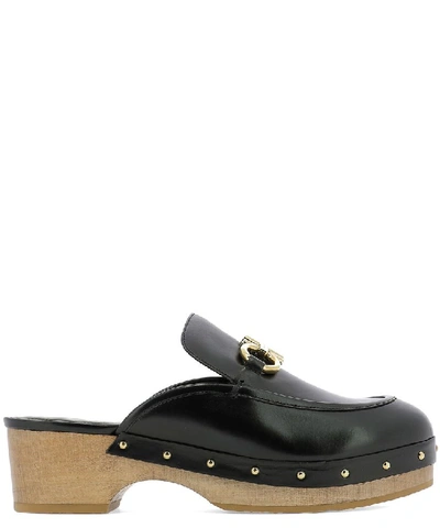 Shop Ferragamo Salvatore  Gancini Stud Embellished Mules In Black