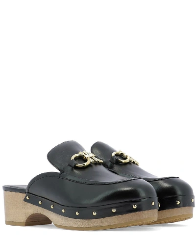 Shop Ferragamo Salvatore  Gancini Stud Embellished Mules In Black