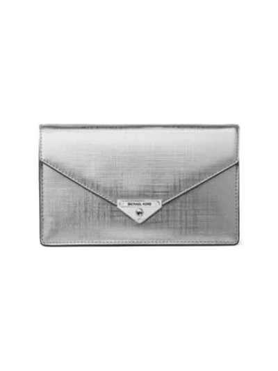 Shop Michael Michael Kors Grace Metallic Leather Envelope Clutch In Silver