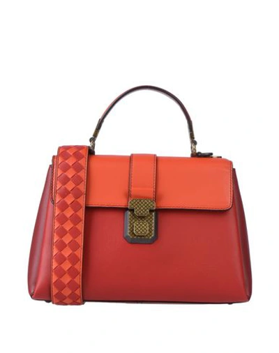 Shop Bottega Veneta Handbags In Red