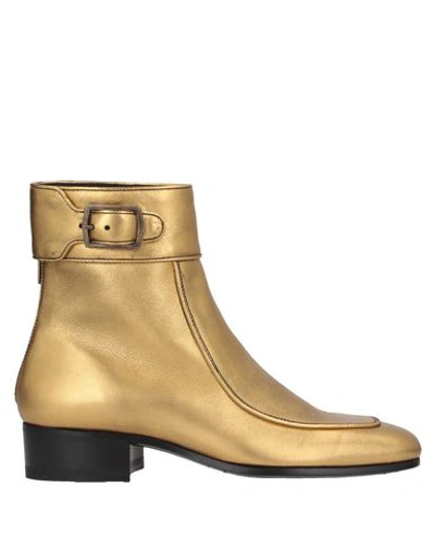 Shop Saint Laurent Ankle Boots In Gold