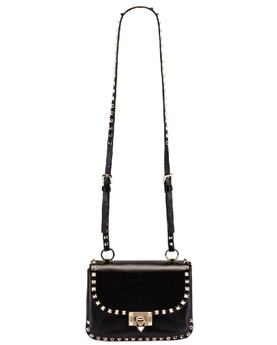 Shop Valentino Small Rockstud Shoulder Bag In Black