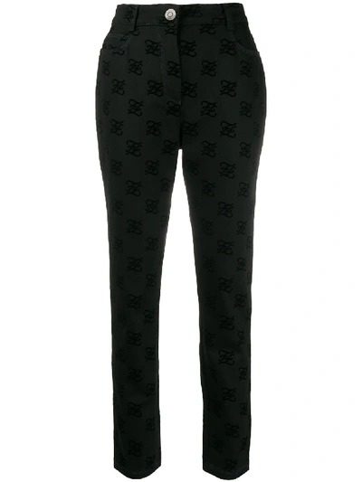 Shop Fendi Karligraphy Motif All-over Logo Trousers In Black