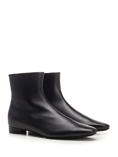 Shop Balenciaga Logo Heeled Ankle Boots In Black