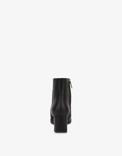 Shop Moschino Elastic Band Leather Ankle Boots In Black