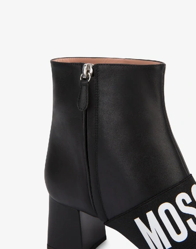 Shop Moschino Elastic Band Leather Ankle Boots In Black