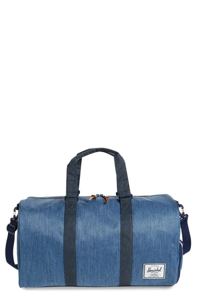 Shop Herschel Supply Co Novel Duffel Bag - Blue In Faded Denim/ Indigo Denim