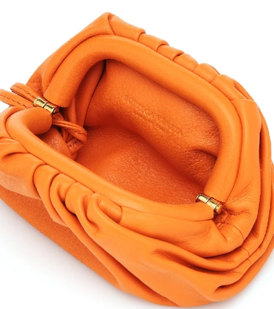 Shop Bottega Veneta The Pouch Mini Leather Clutch In Orange